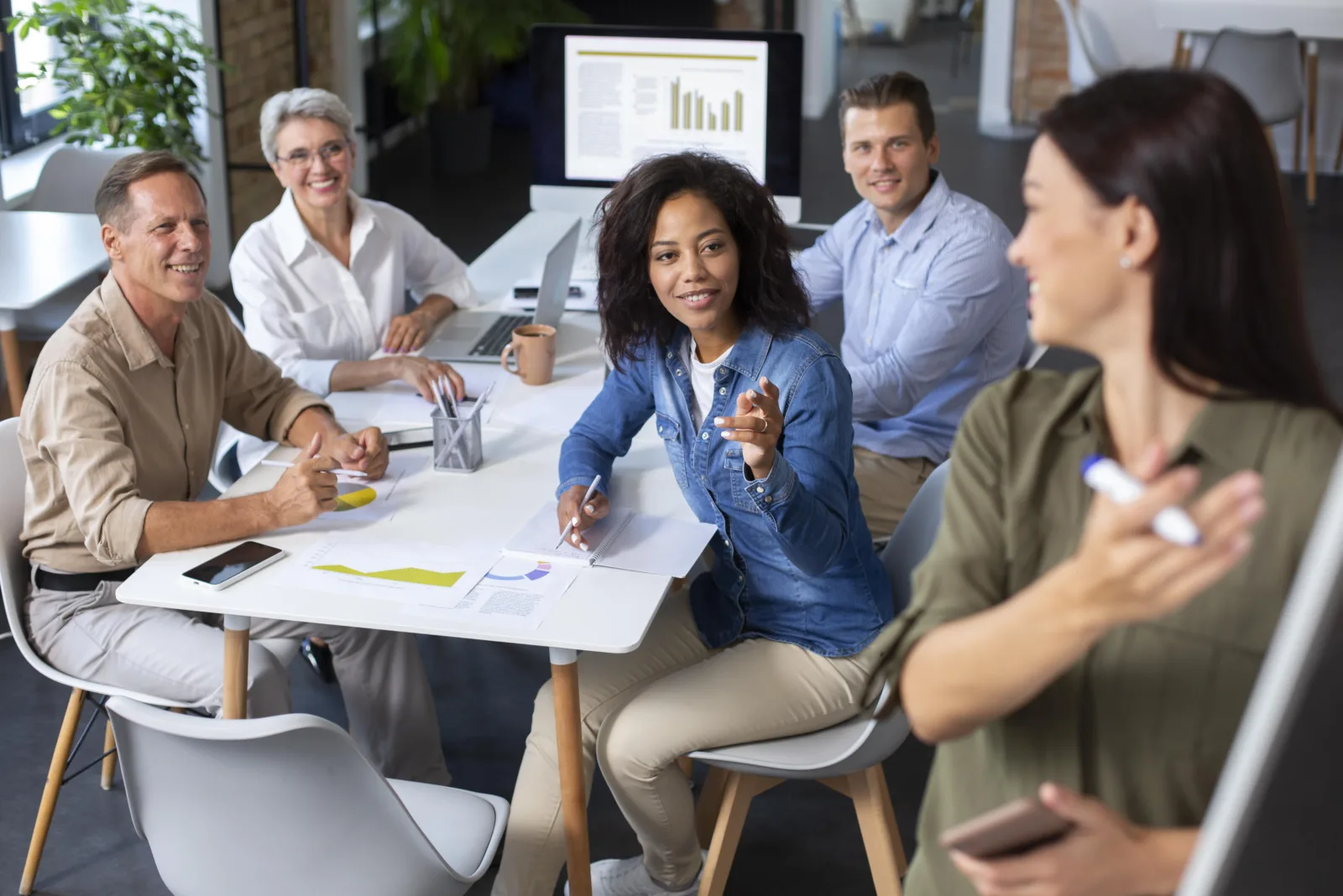 People using digital device while meeting placeholder